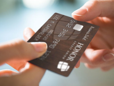 business-debit Handing a Business Debit card to member