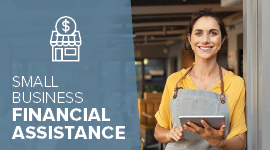 image of a business owner smiling while holding a tablet device with text that explains financial assistance is available for small business owners
