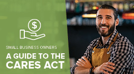 photo of a business owner smiling with his arms crossed