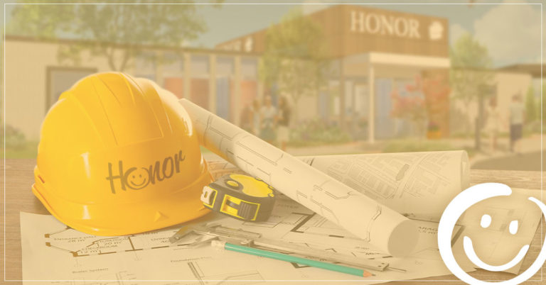 image of a construction hat resting on a table with a background rendering image of the new berrien springs member center