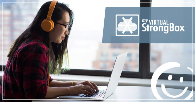 image of a woman wearing headphones while typing on a laptop keyboard